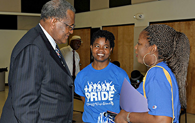 Dr. George Cooper talks with Trudi Golphin, director of residence life and Linda Smith, director of Annual Giving and Alumni Affairs at a Pride Week event in March.